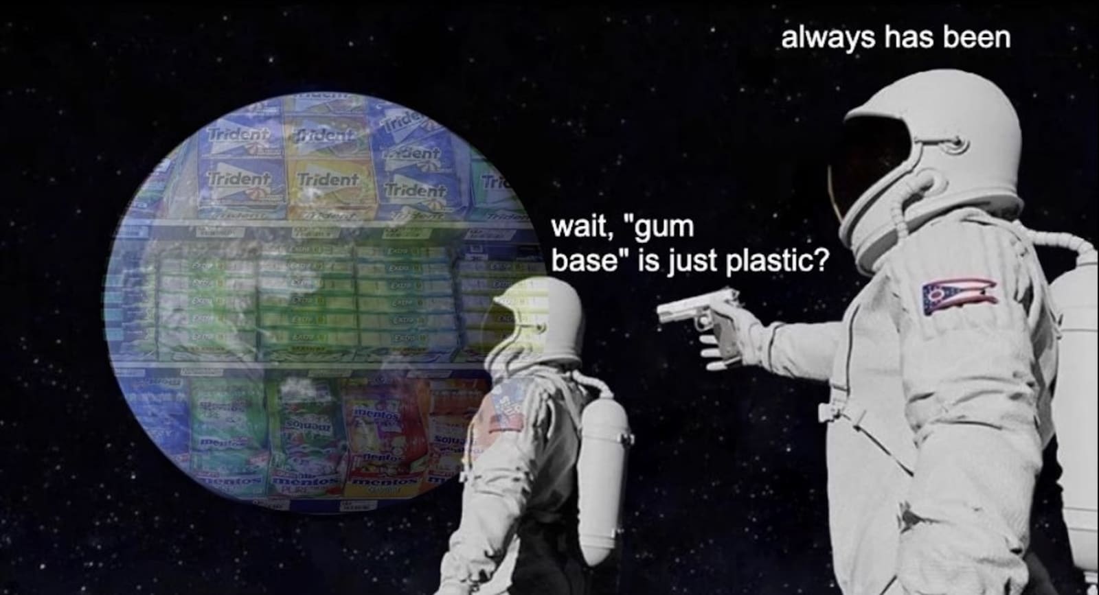 An astronaut points a gun at another astronaut who questions the plastic content of chewing gum