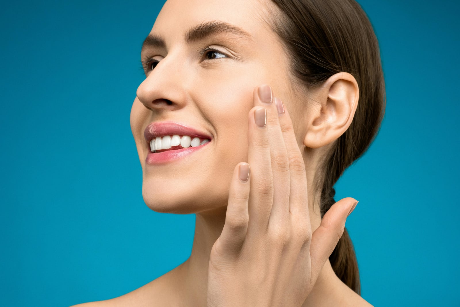 A woman with perfect teeth smiling