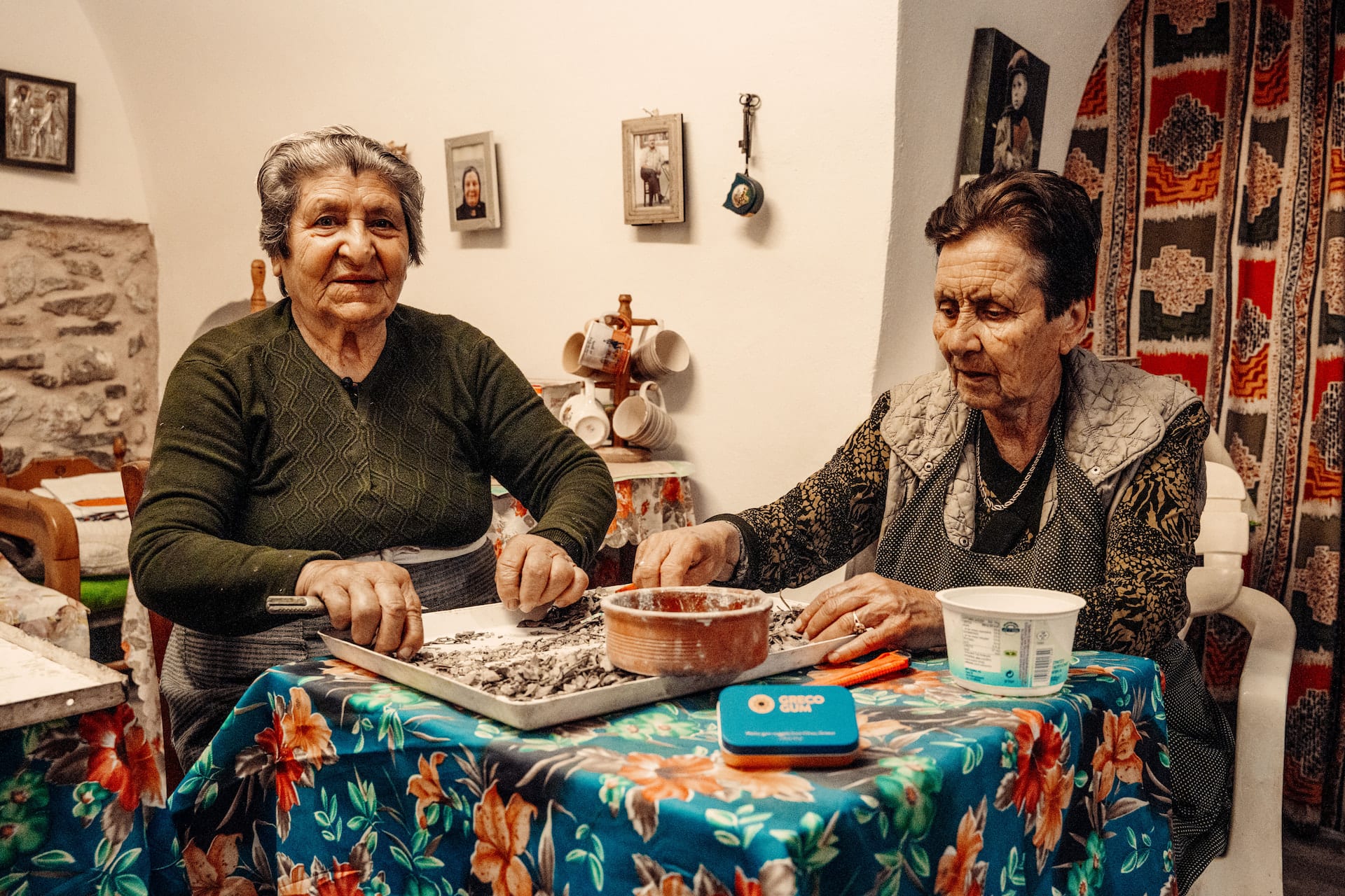 Two elderly Greek women sorting mastic gum by hand