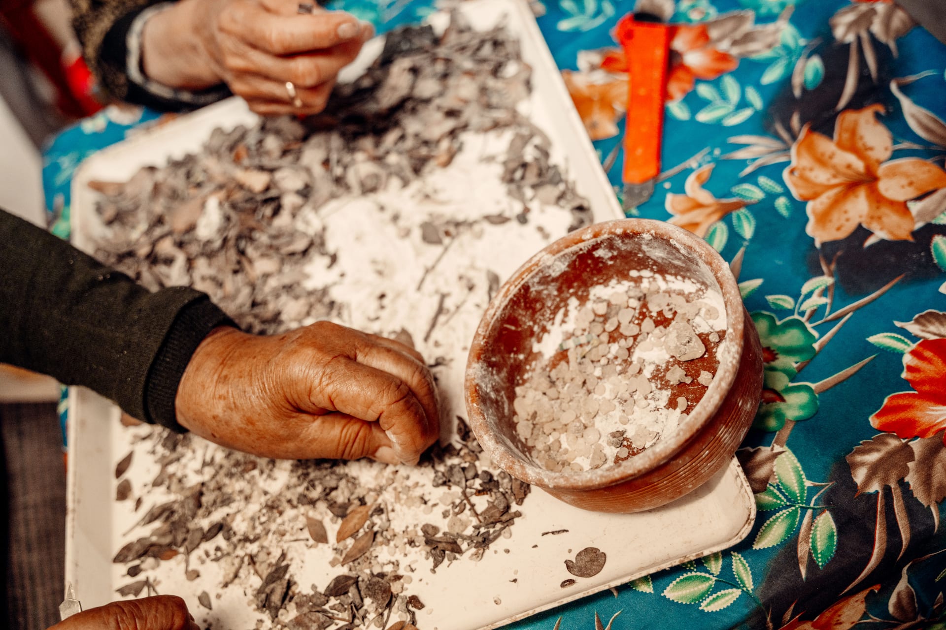 Mastic resin is sorted and cleaned by hand.