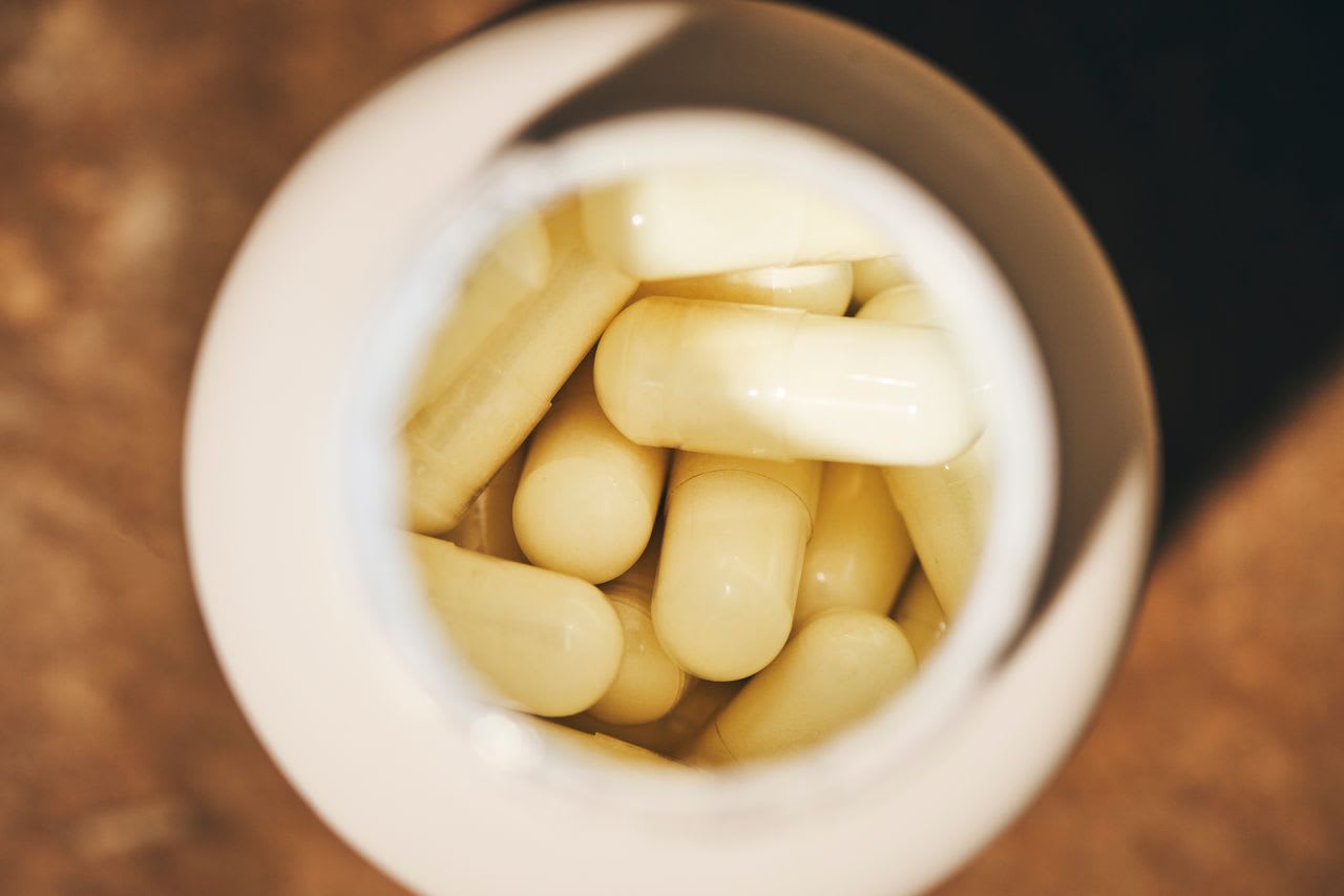 Mastic gum capsules inside their bottle