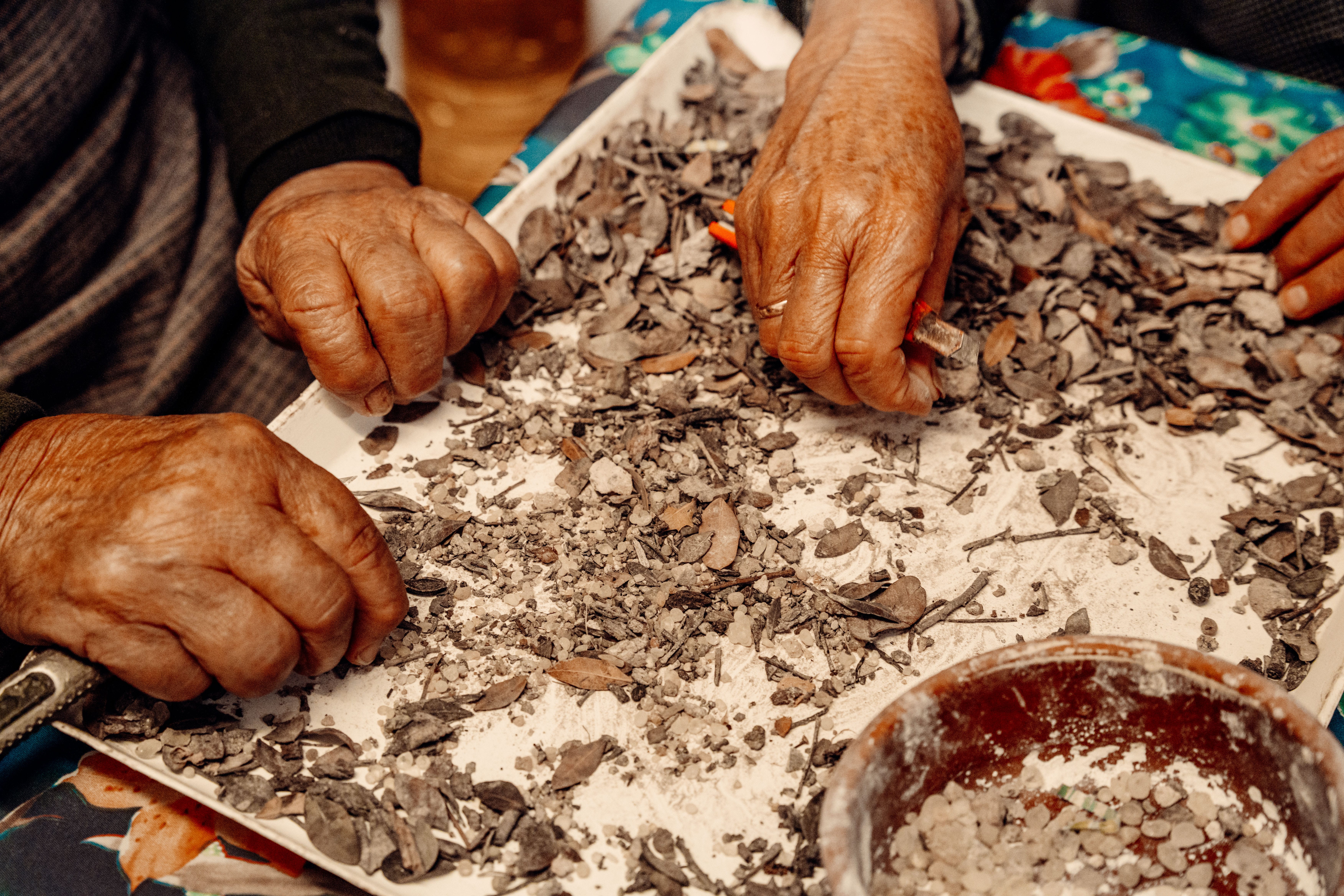 Greek locals clean and sort mastic resin