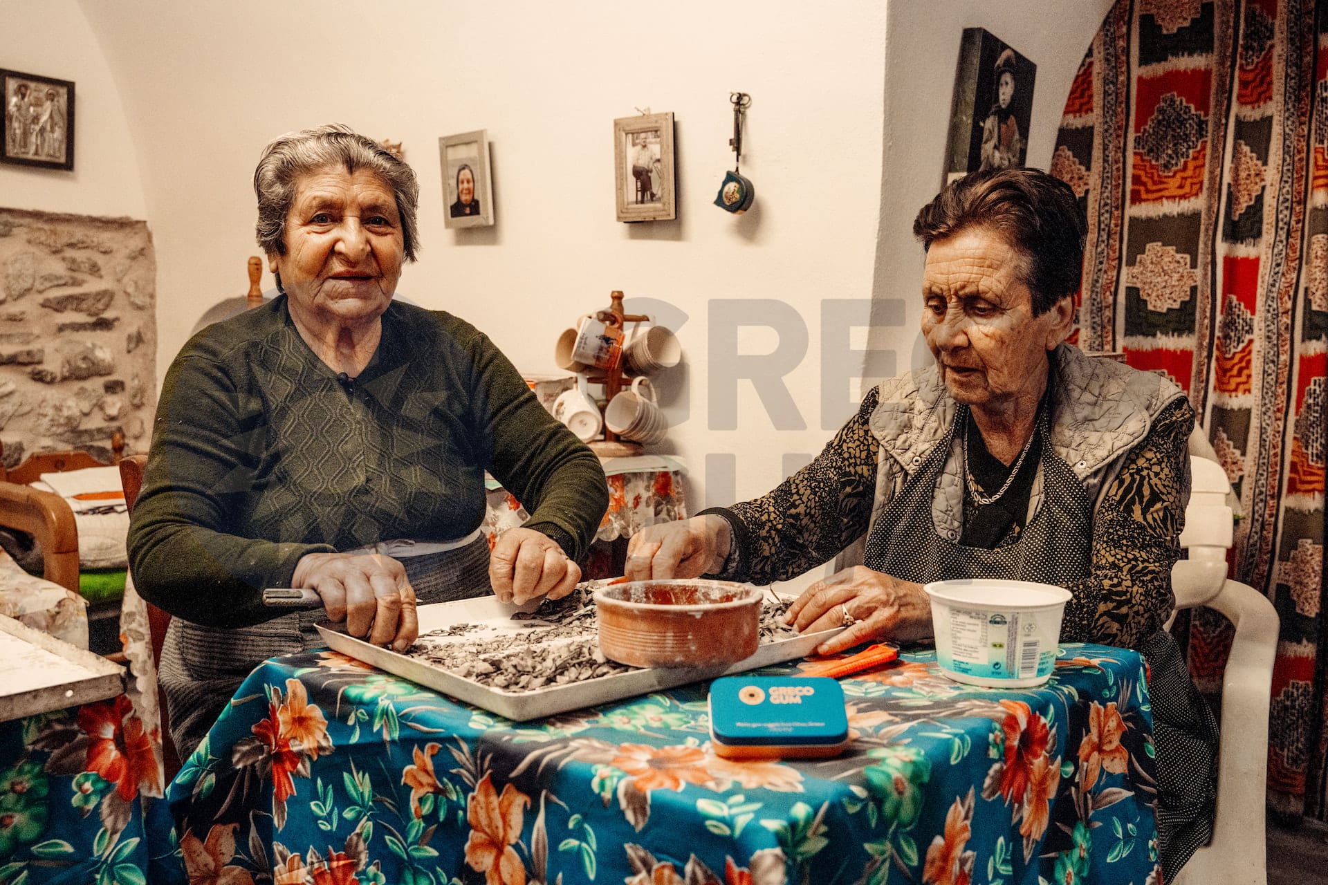 Two elderly Greek women sorting mastic gum by hand
