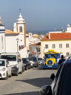 Our street with colorful tourist train