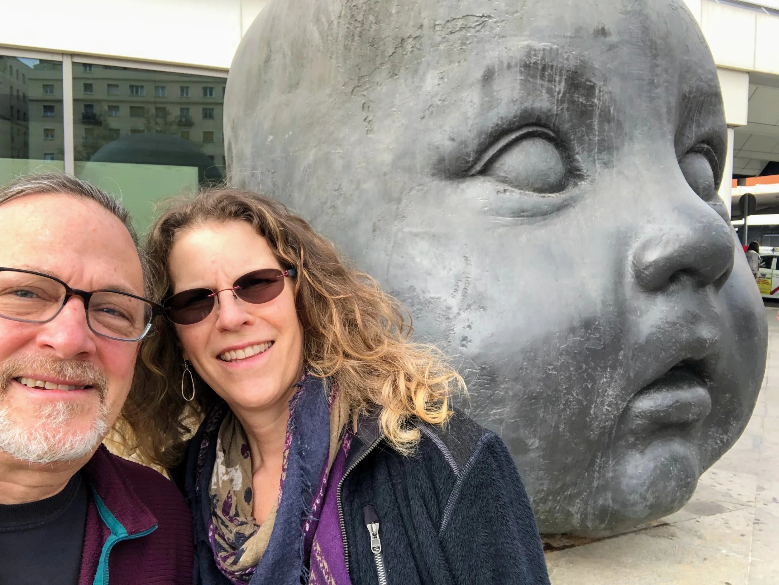 Giant baby head sculptures at Atocha Station
