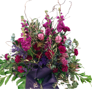 Gesteck aus pinken und lila Blumen "Dankbarkeit".