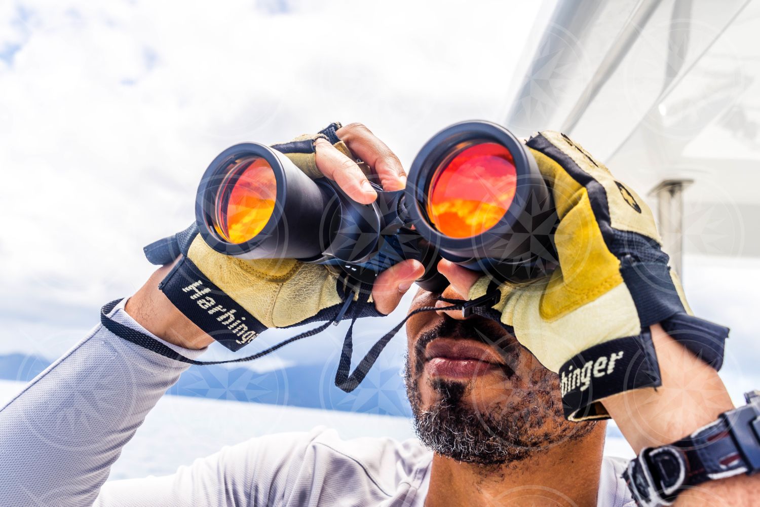 Man looking through binoculars