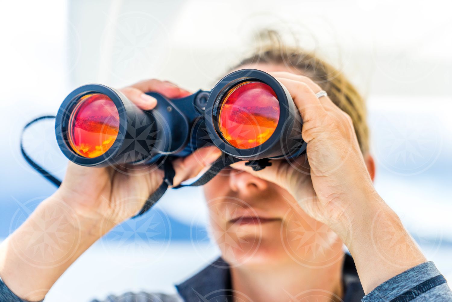 Woman looking through binoculars