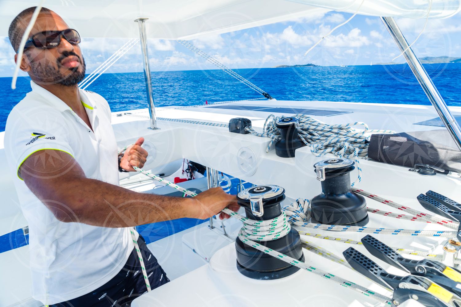 Man working lines on sailboat