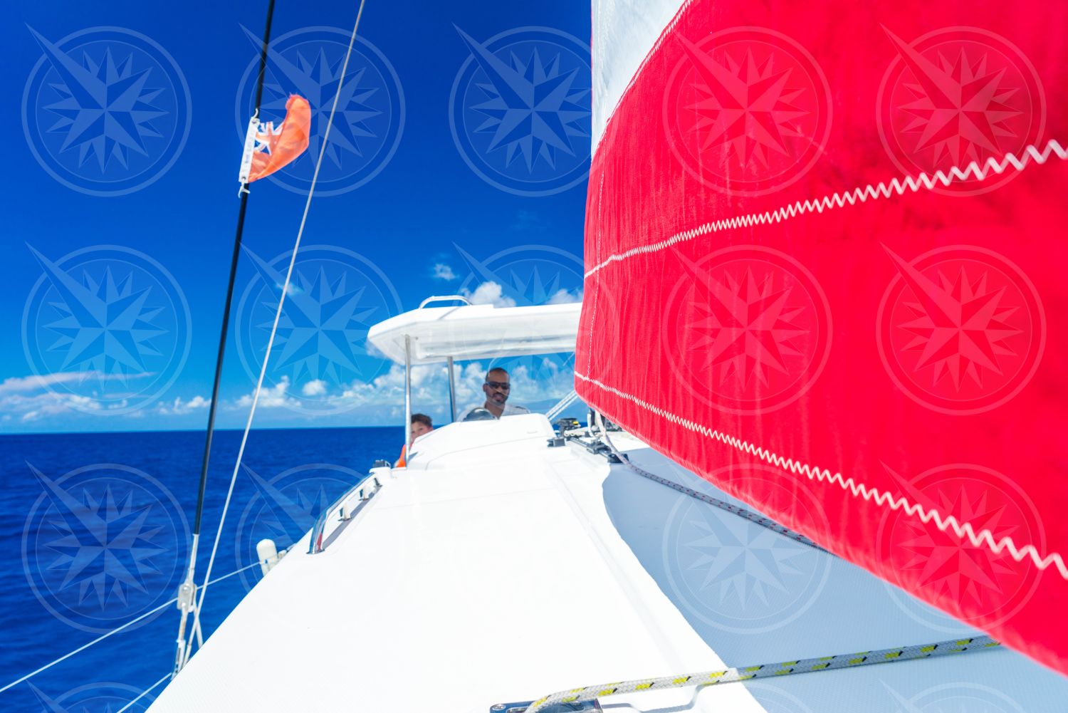 Man at the helm catamaran