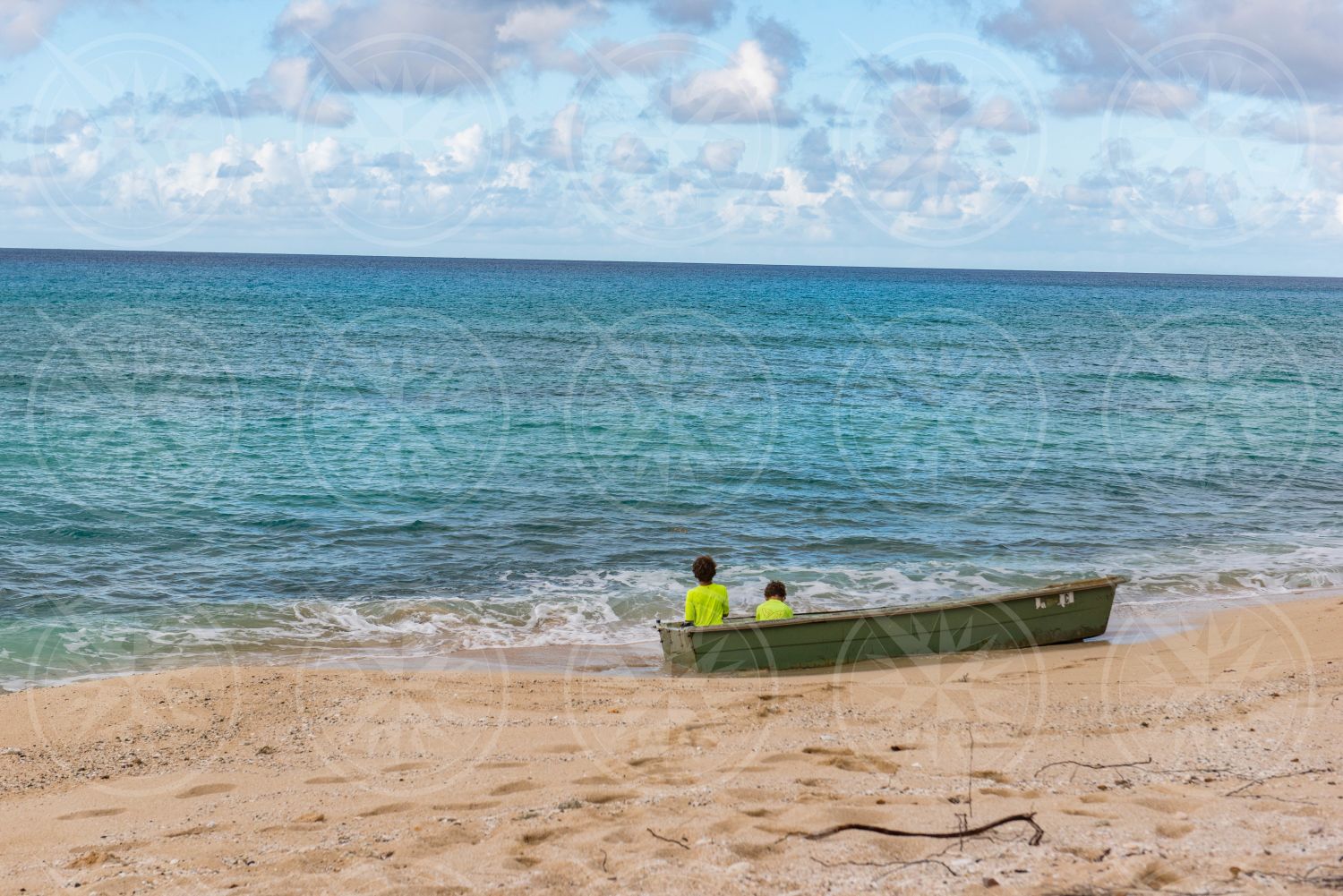 Young boys in a boat on a beach