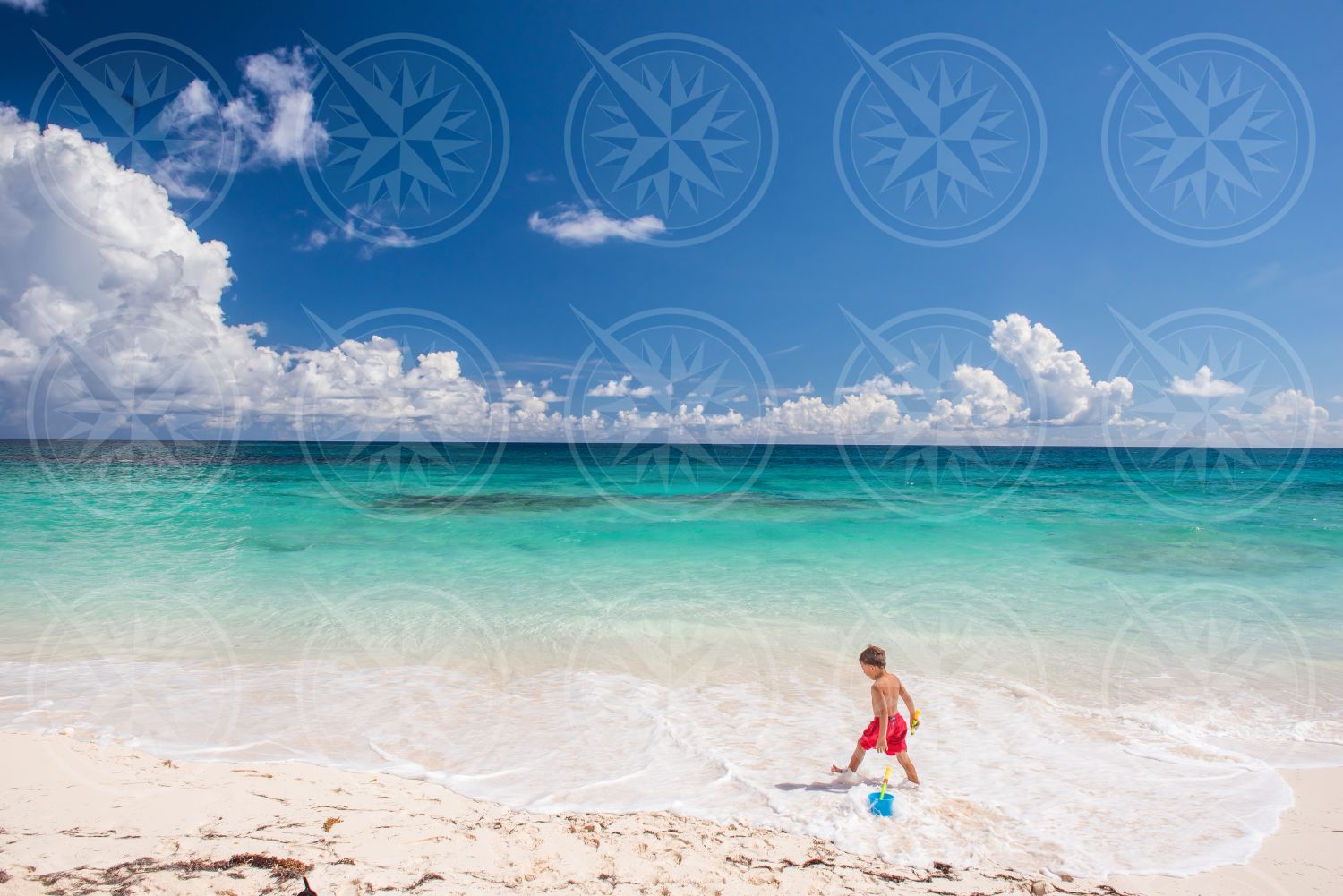 Boy on white sand beach