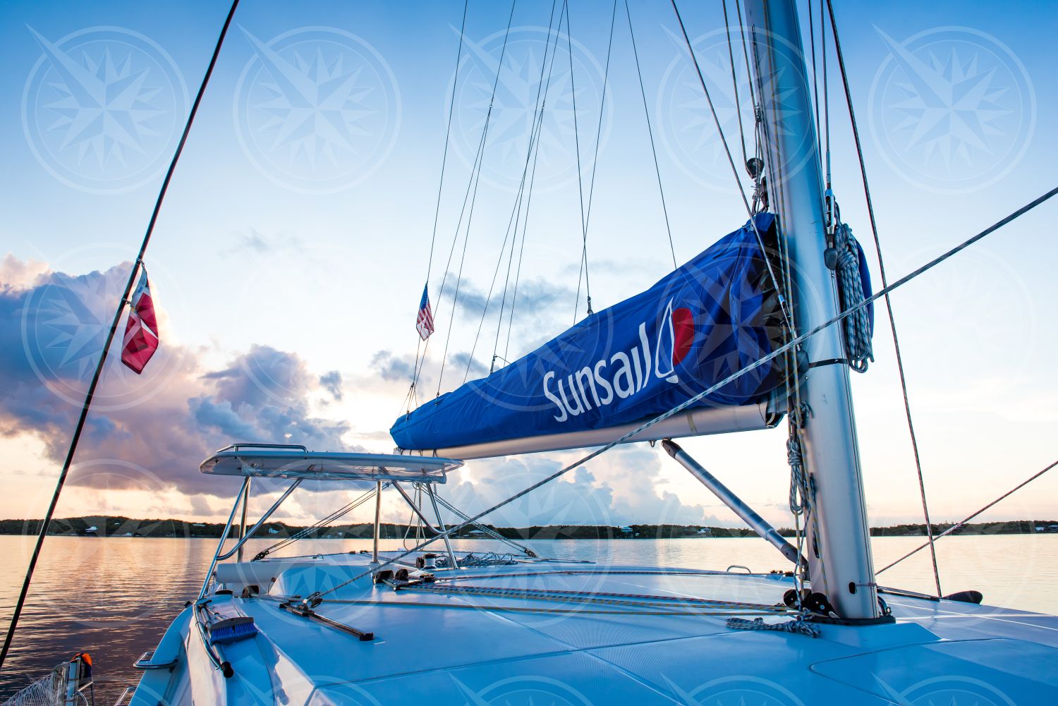 Sunrise over a sailboat