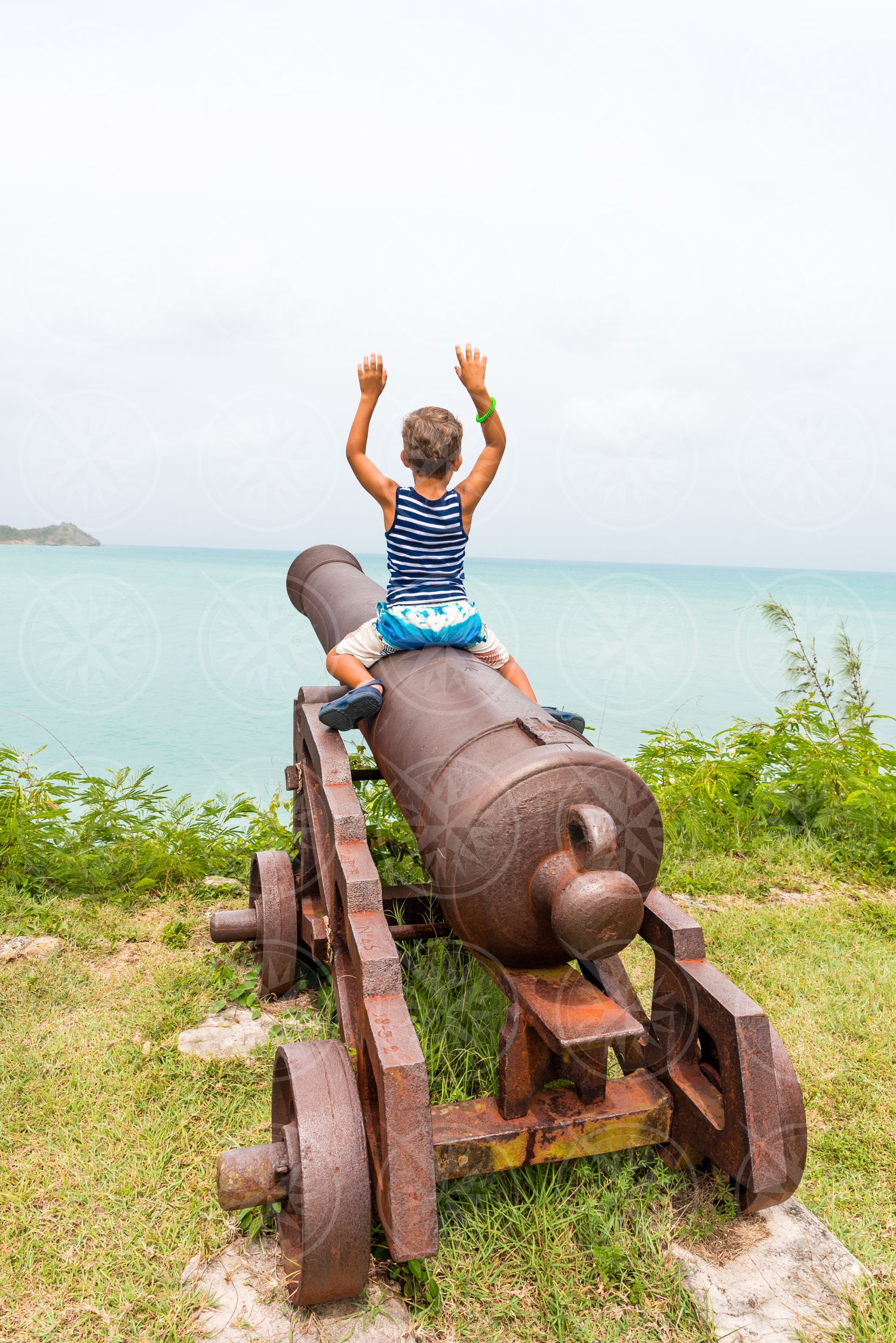 Boy on cannon at Fort James 2