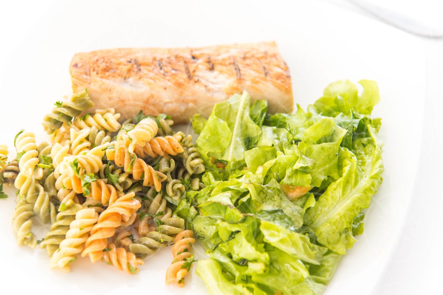 Fish, pasta, and salad