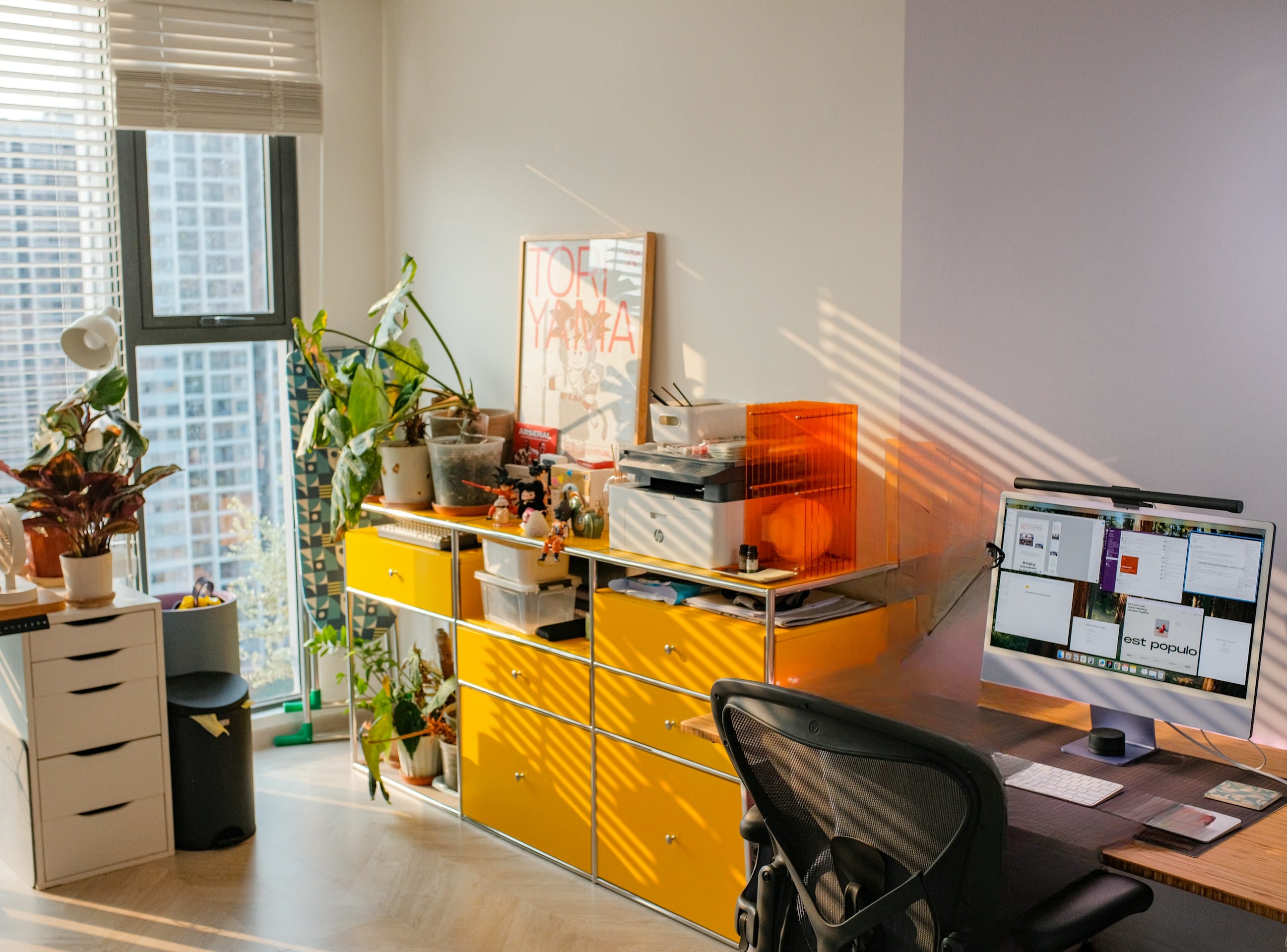 A person is working at a bright home office.