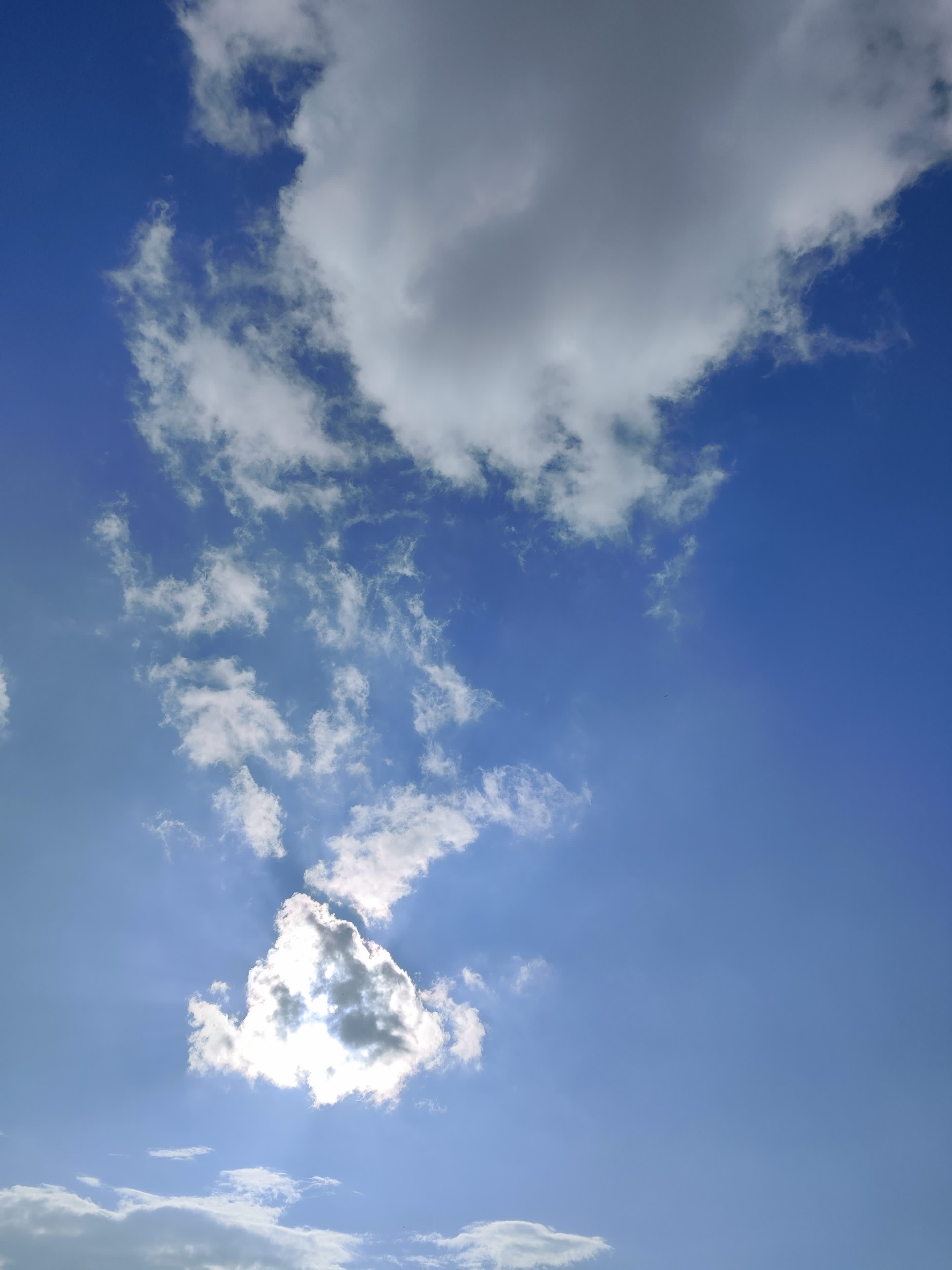 Sunbeams breaking through a solitary cloud