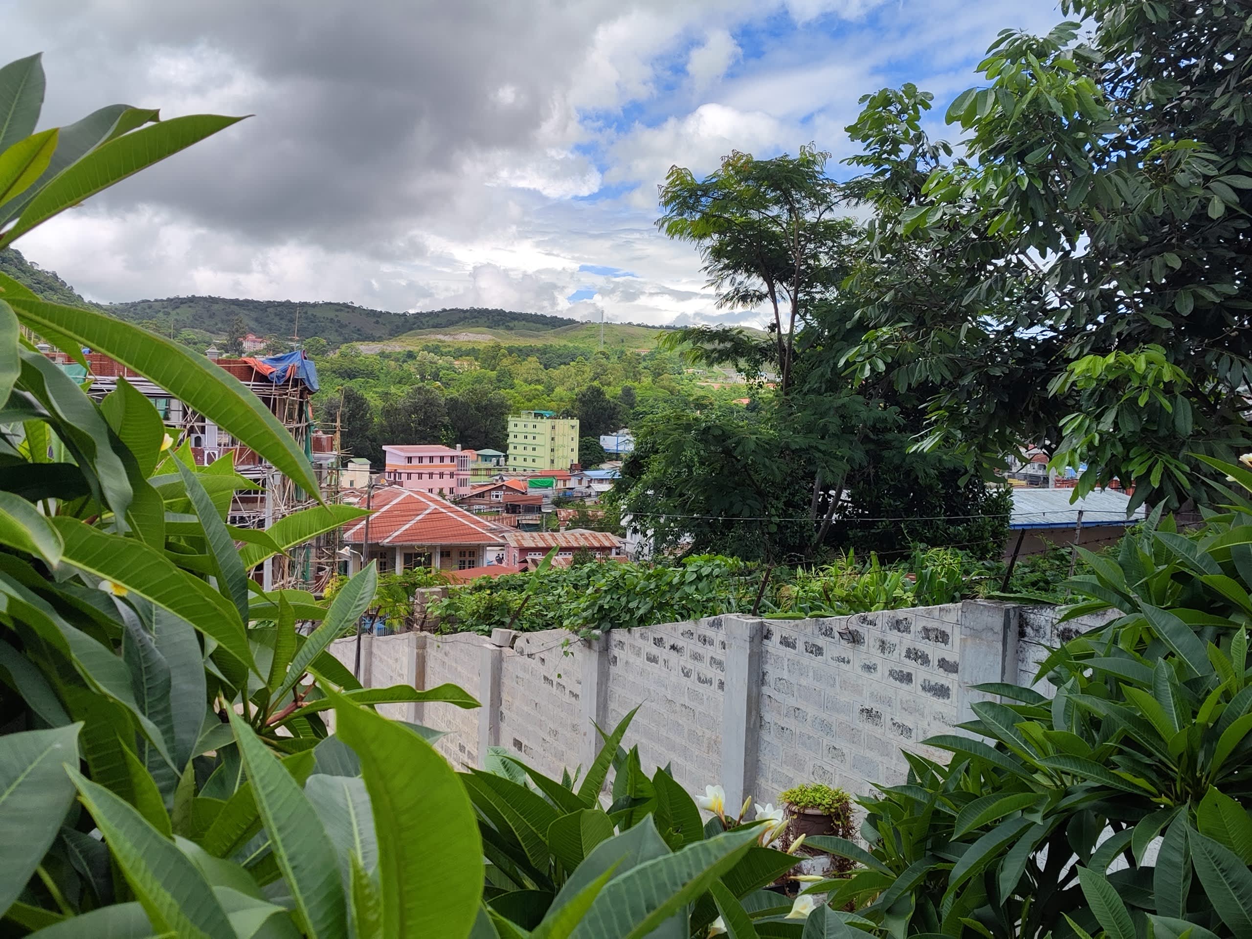 Taunggyi hillside neighborhood through trees
