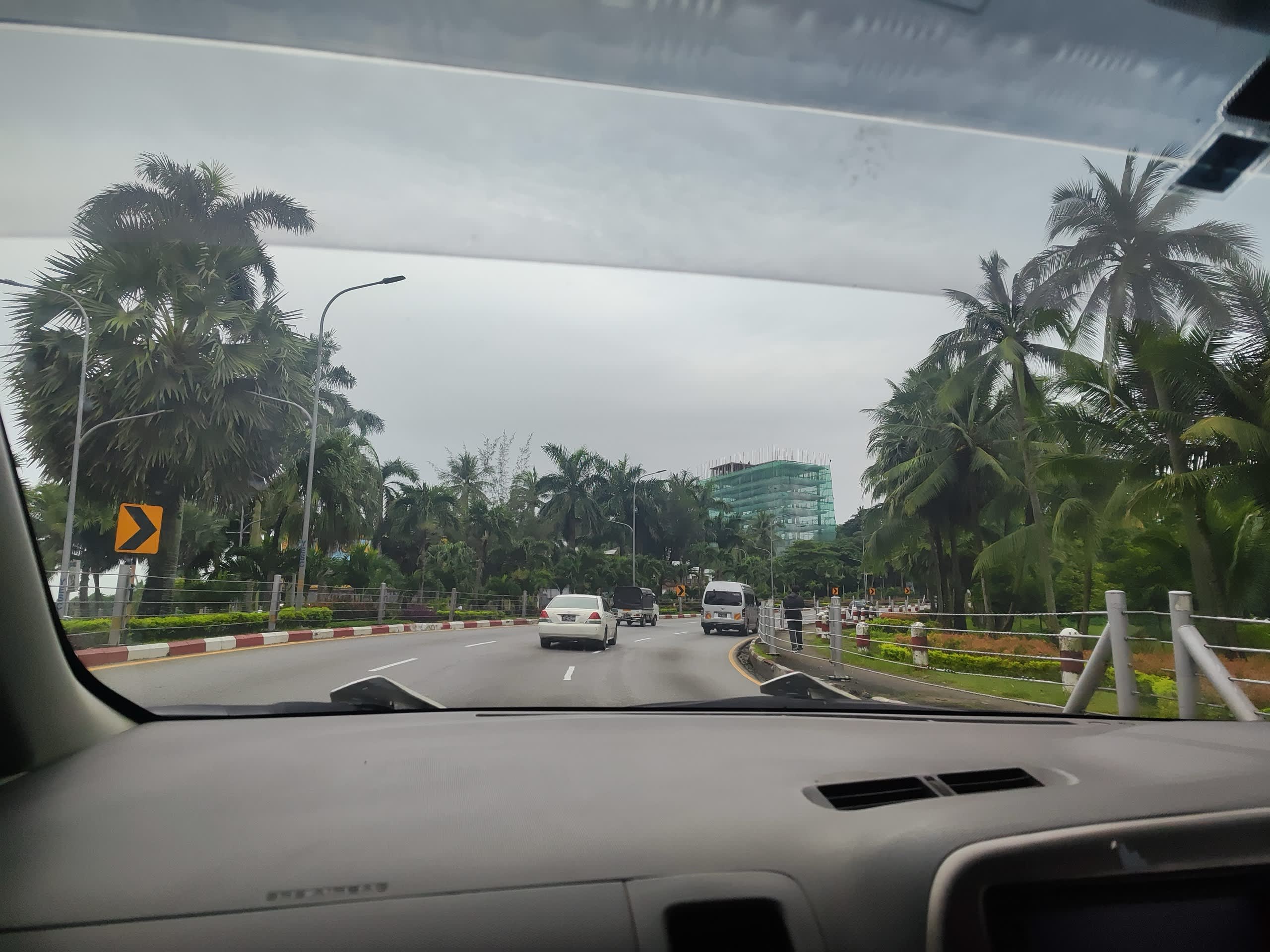 entering_yangon_city_through_palm_lined_road