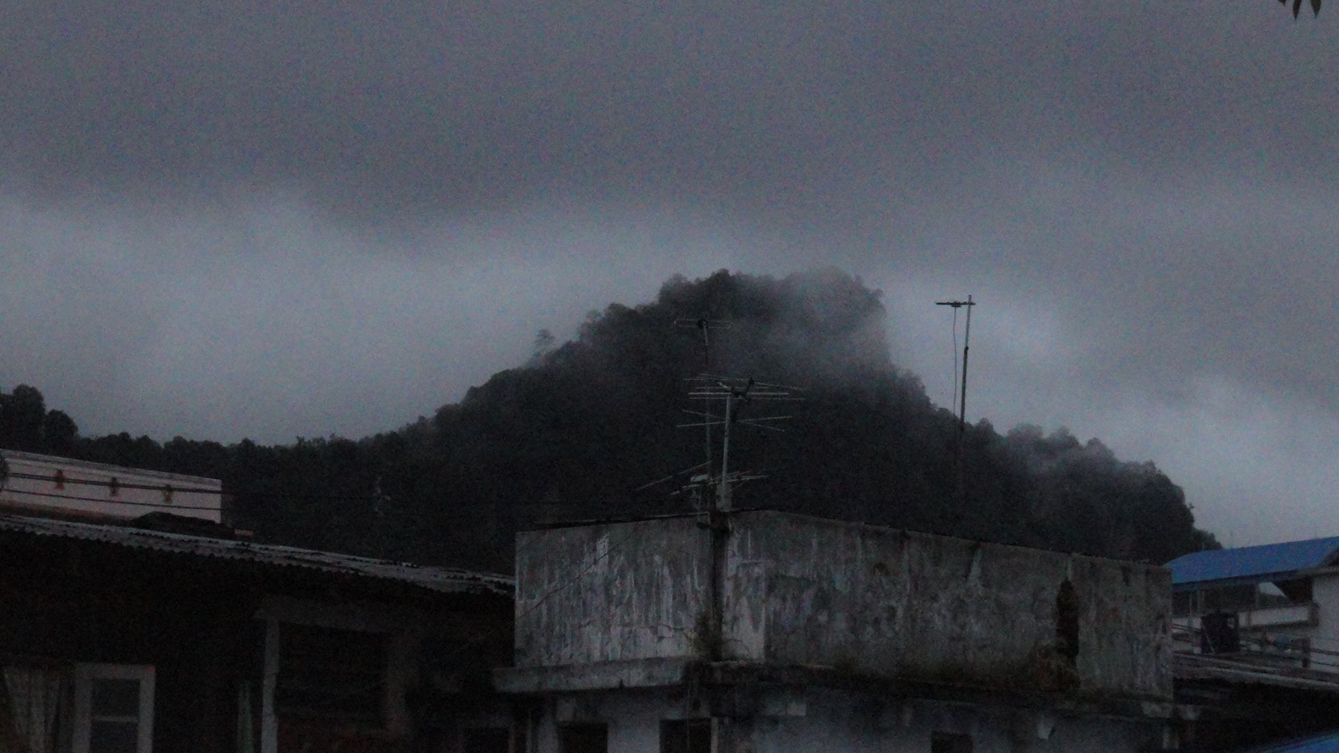 mountain_view_beside_my_house_during_a_misty_day