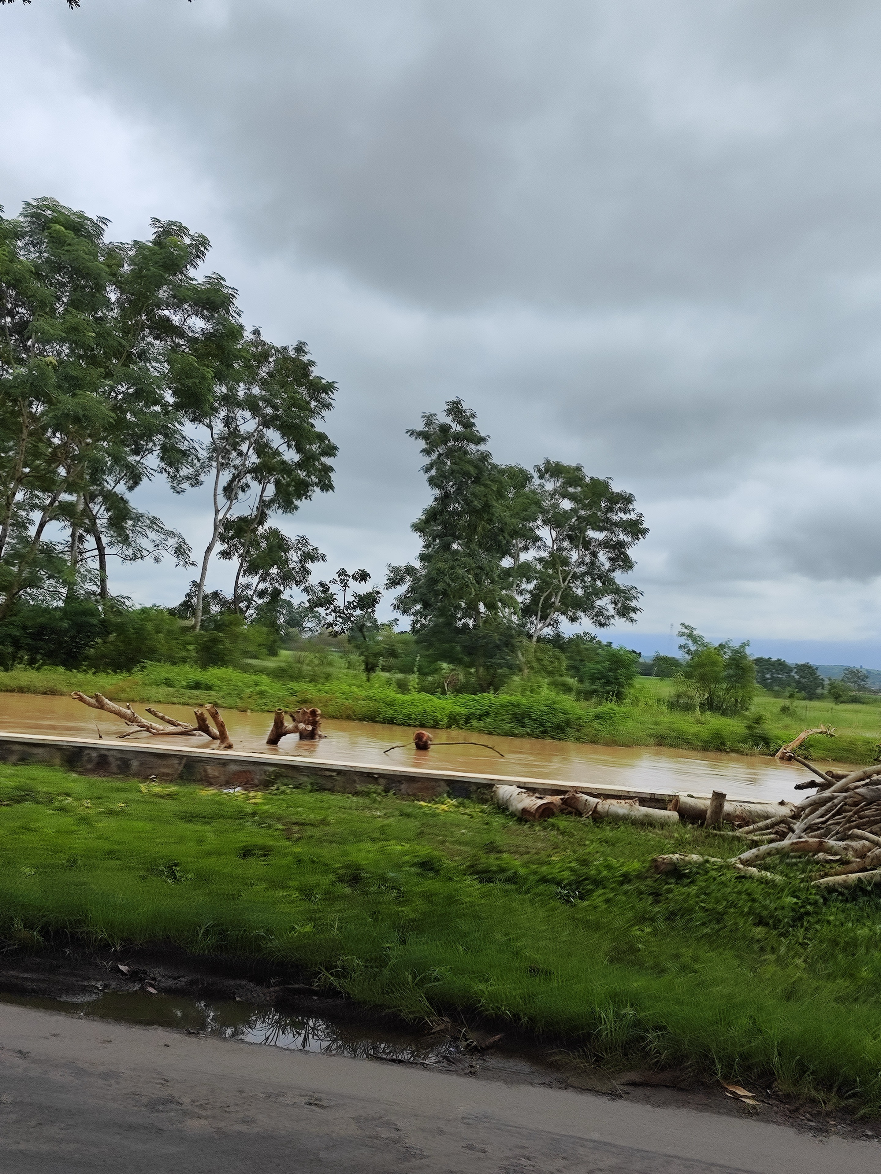 Monsoon clouds over the swollen river