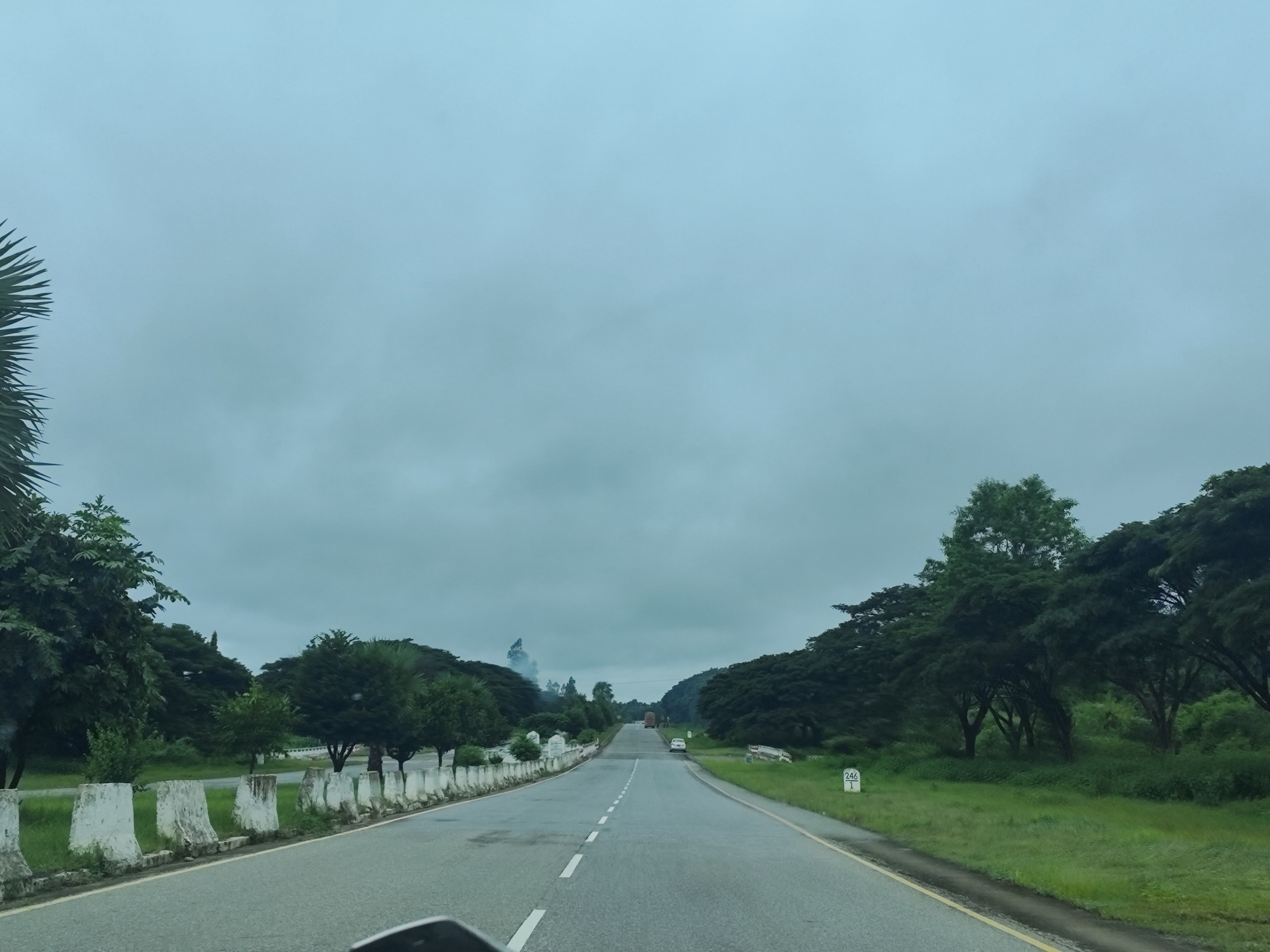 Long stretch of highway under cloudy skies