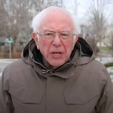 Bernie Sanders Once Again Asking meme template: Bernie Sanders in a winter coat, looking directly at the camera with an earnest expression.