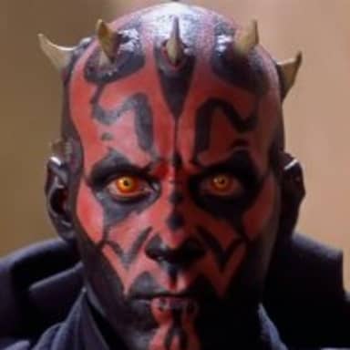 Darth Maul meme template: Close-up of Darth Maul's face, with his red and black markings, yellow eyes, and horns.