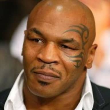 Disappointed Tyson meme template: Close-up portrait of Mike Tyson looking slightly displeased or unimpressed.