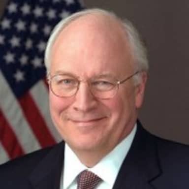 Dick Cheney meme template: A portrait of Dick Cheney, smiling and wearing a suit, with an American flag behind him.