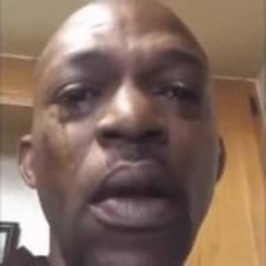 Black Man Crying meme template: Close-up of a Black man's face with tears welling in his eyes, mouth slightly open, looking distressed.