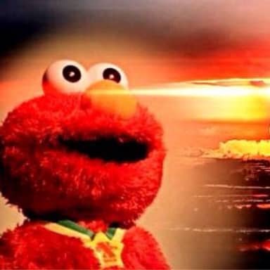 Elmo Nuclear Explosion meme template: Elmo with a wide, unsettling smile stares forward as a nuclear explosion erupts in the background.