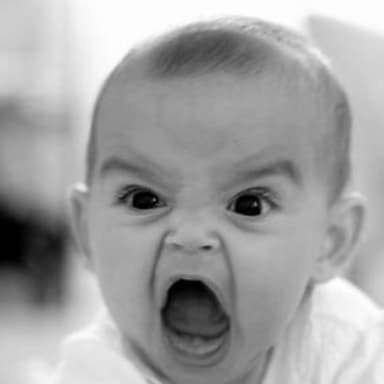 Angry Baby meme template: Close-up black and white photo of a baby's face with an extremely angry, yelling expression.