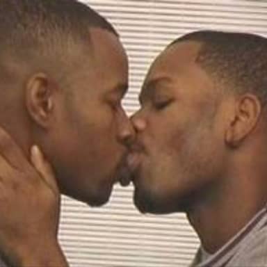 2 Gay Black Mens Kissing meme template: Two men kissing passionately, eyes closed. One man's hand is cupping the other's neck.