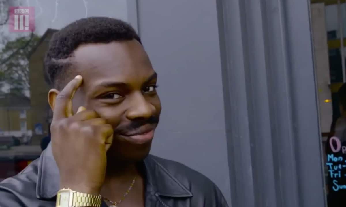 Eddie Murphy Thinking meme template: Man taps his temple with his index finger, conveying a moment of realization or a clever idea.