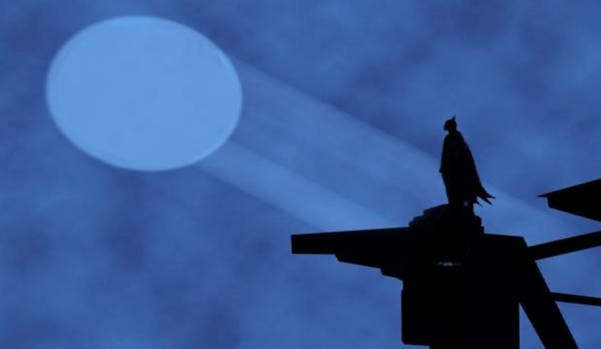 Batman Signal meme template: A silhouette of Batman standing on a rooftop, looking up at the Bat-Signal projected into the night sky.