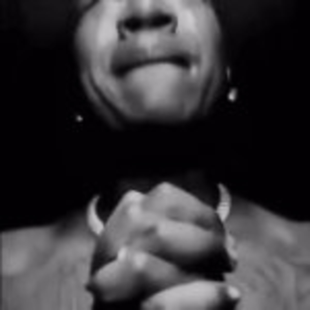 Black Guy Praying meme template: Close-up of a Black man with his hands clasped in prayer. His eyes are closed, and his expression is earnest.