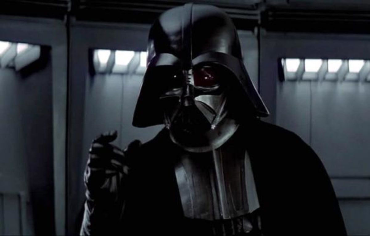 Darth Vader meme template: Darth Vader in his iconic suit, looking intensely at the viewer. He is raising his hand with his fingers spread, as if to emphasize a point or make a statement.