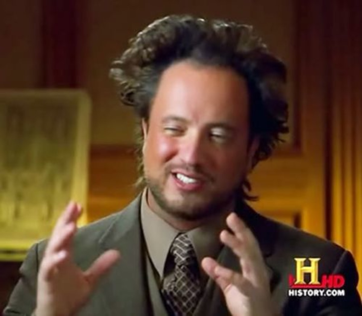 Aliens meme template: A man with wild hair and wide eyes gestures with his hands. The background is a dimly lit room.