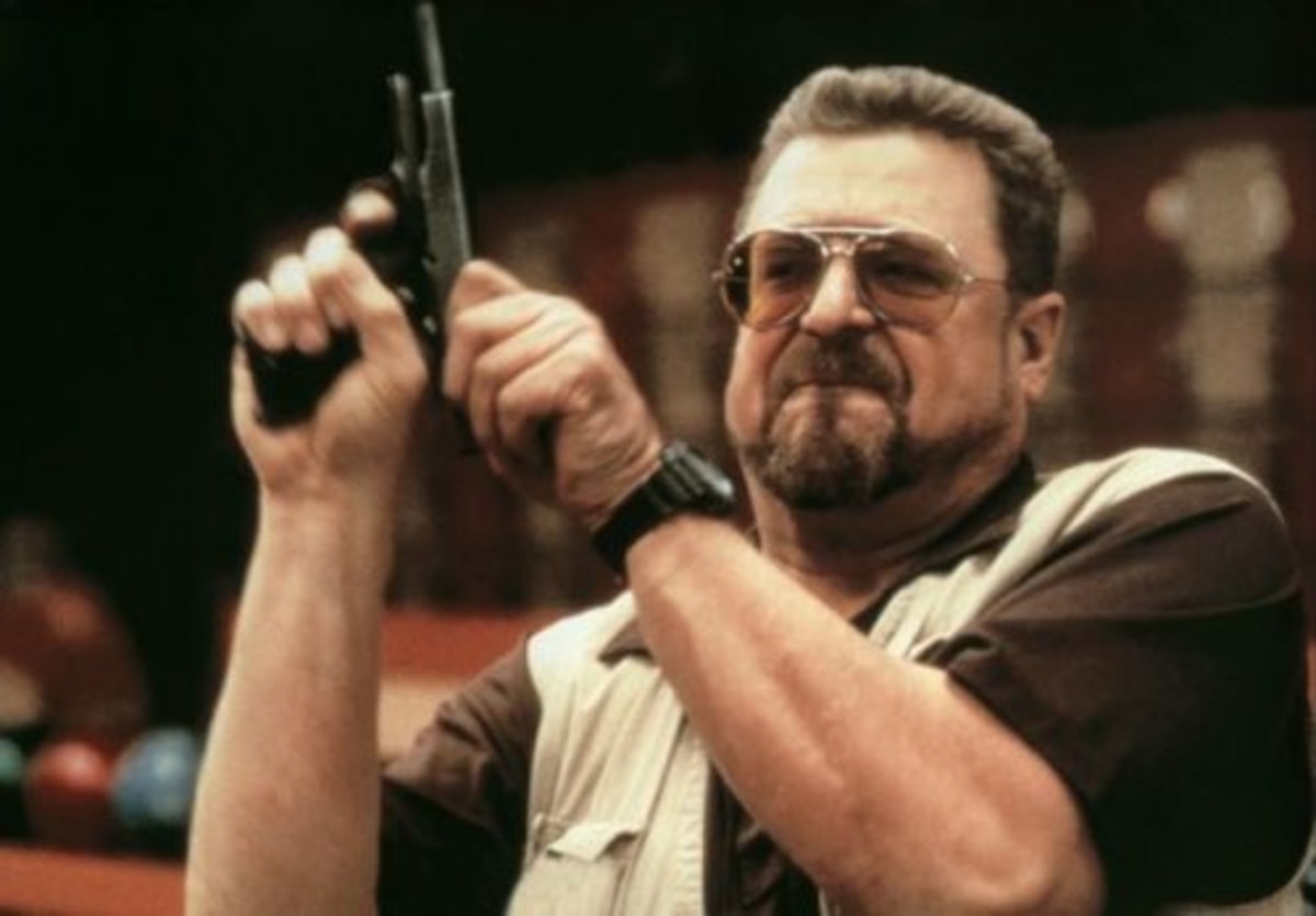 Am I The Only One Around Here meme template: A man in sunglasses, with a goatee, holding a pistol up to his head, looking sternly at the camera.