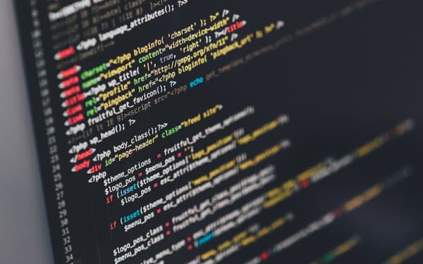 Code on a monitor in a dark room