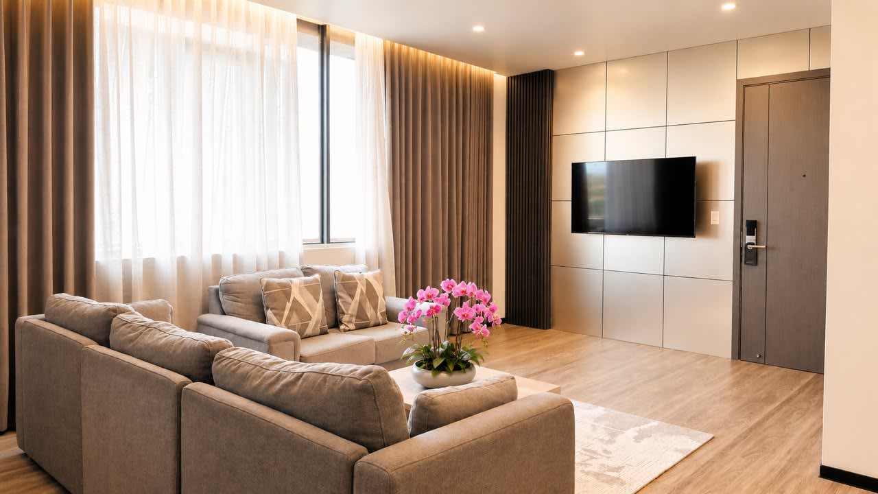 Grand Resort long-stay suite living room with seating area and television
