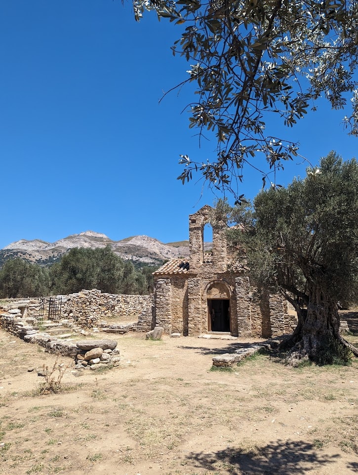 Old Byzantine Church surrounded by olive trees