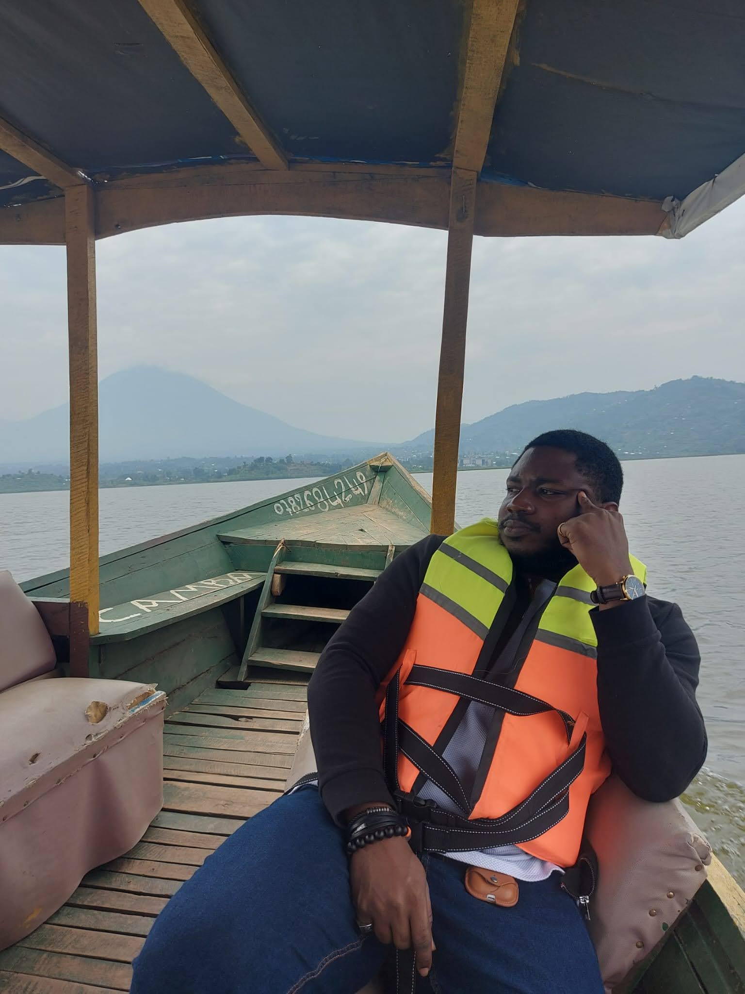 Dennis on a boat in Rwanda