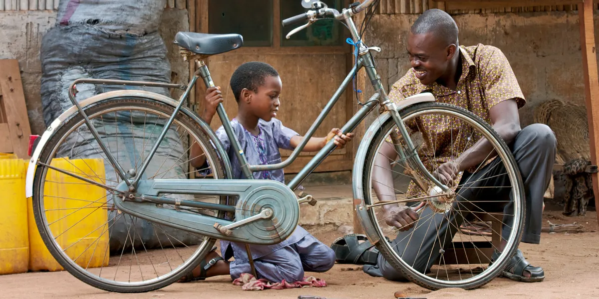 A father with his son on a bike