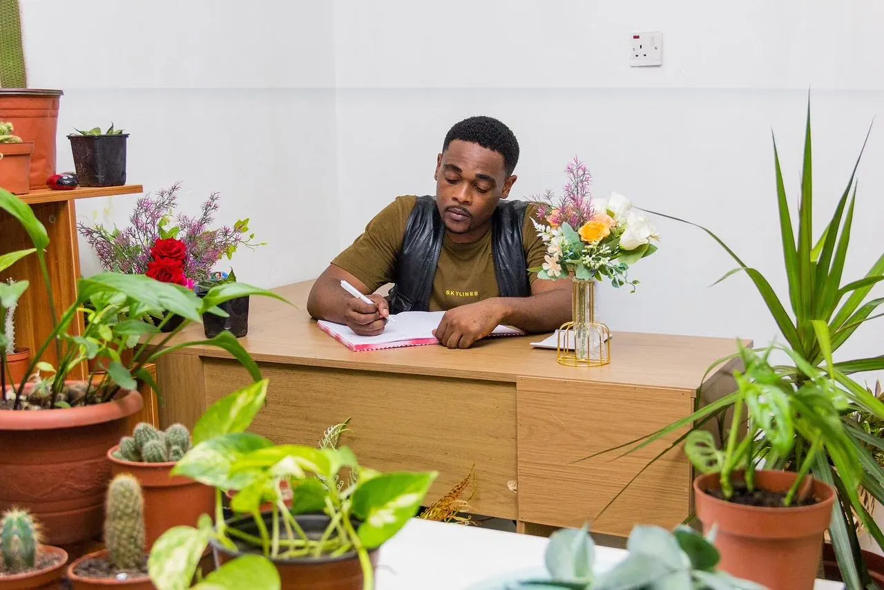 Derrick in his flower office