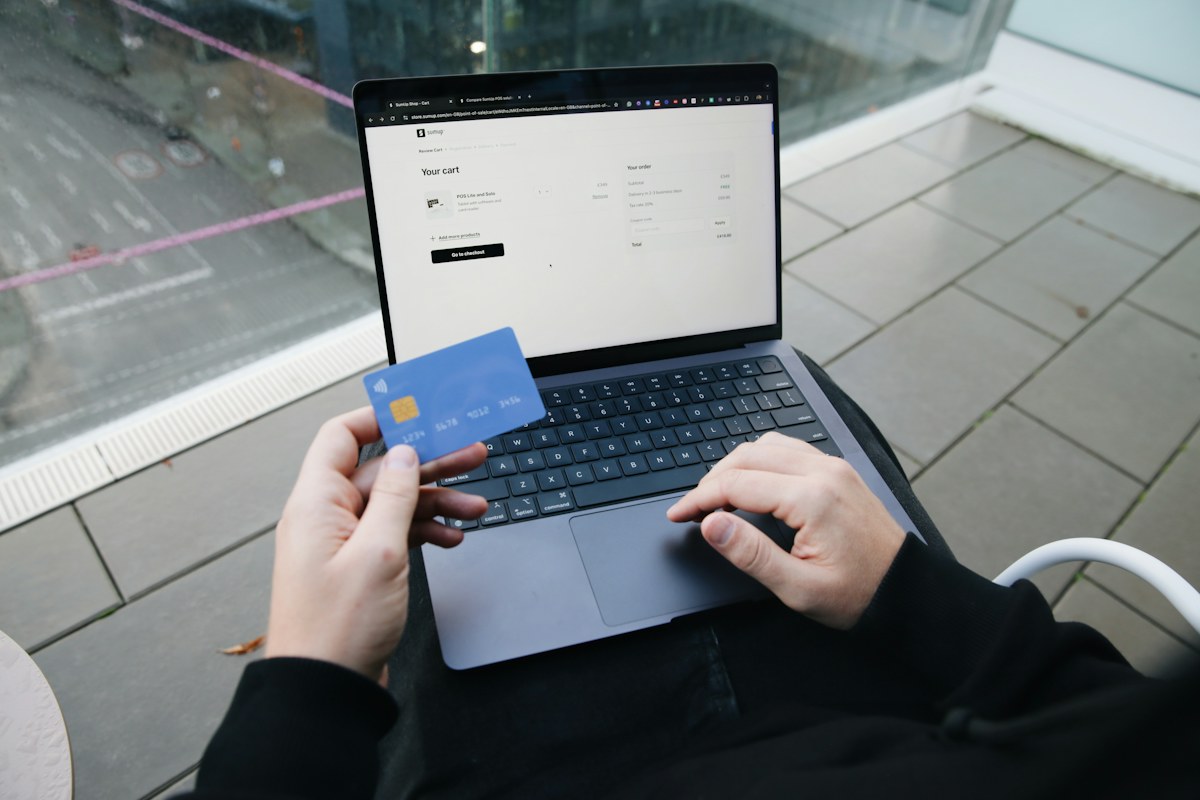 Shopper with a laptop and payment card