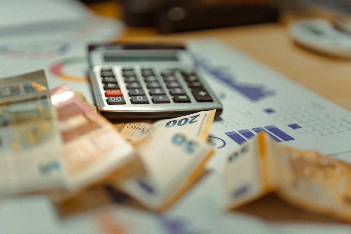 Calculator resting on a stack of money