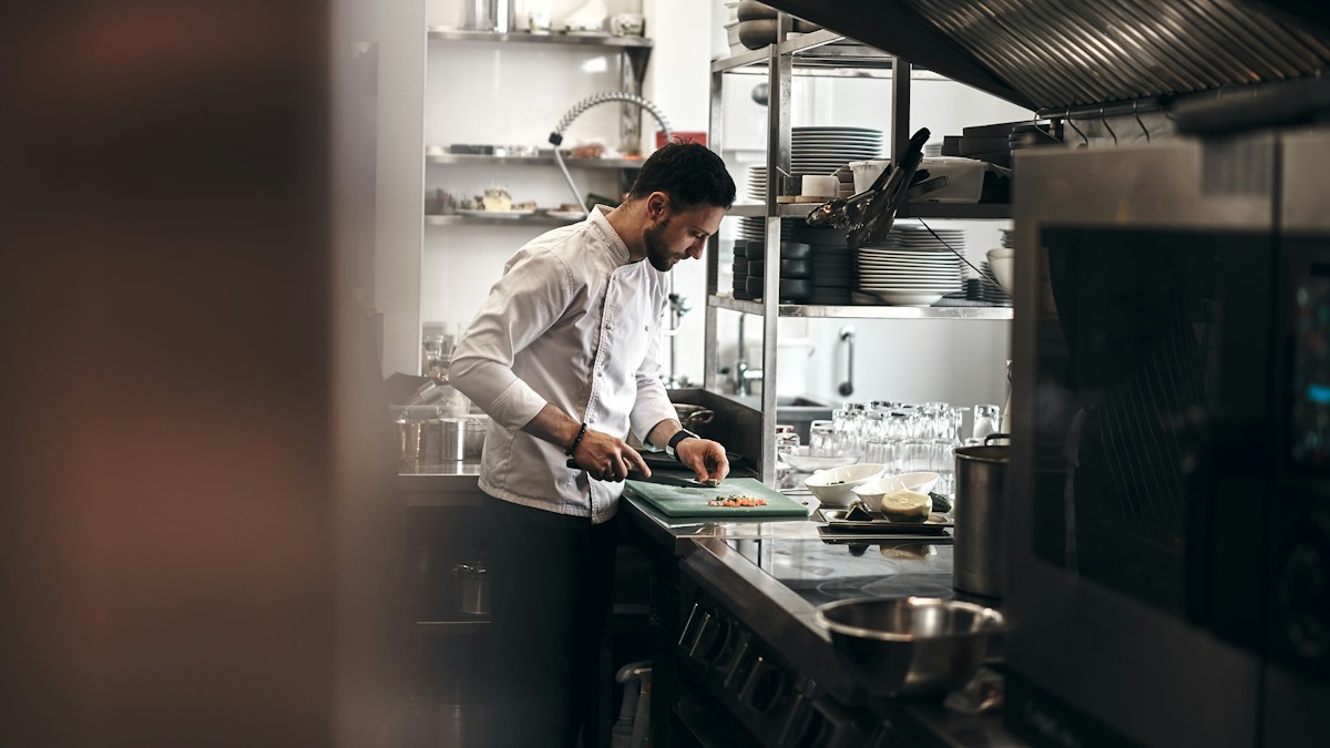 Chef preparing food in a restaurant kitchen
