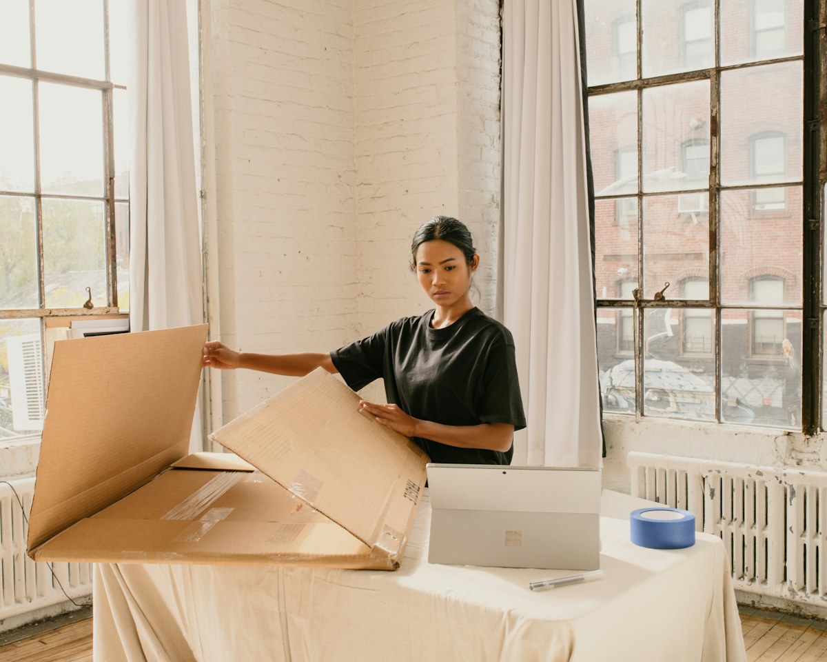 Small-business seller preparing a parcel